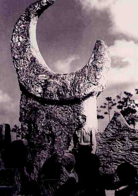 Ed Leedskalnin with His 18-Ton Moon Carving at Coral Castle.